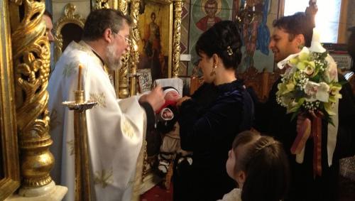 Împărtășire copil la botez